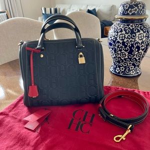 Carolina Herrera handbag in perfect condition. It comes with the dust bag.